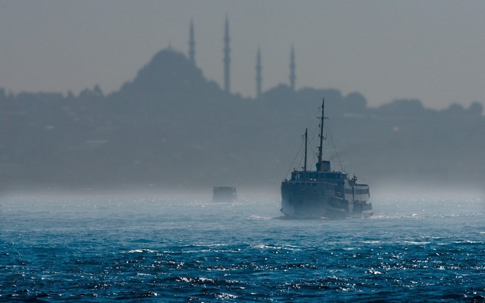 Ferry on the sea with Istanbul skyline in the background