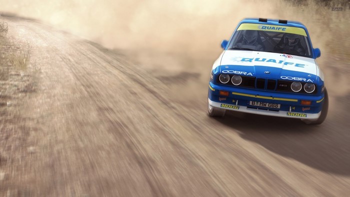 BMW M3 E30 rally car on a dirt road