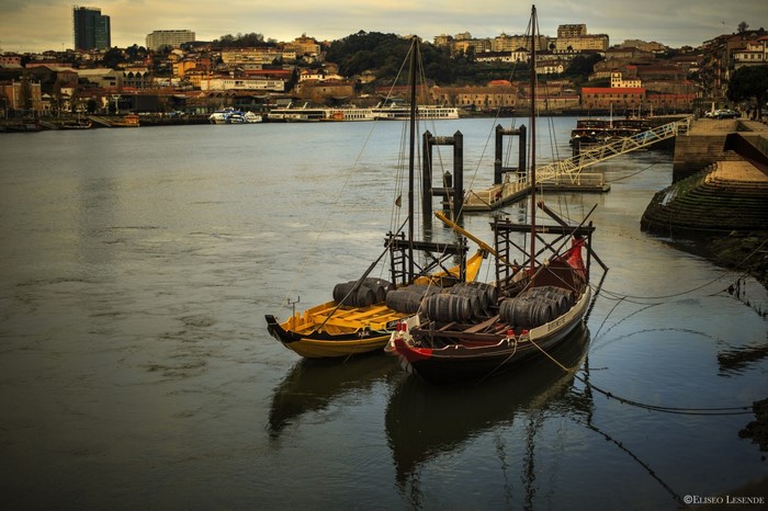 Boats with barrels on a river in Porto
