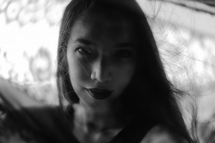 Monochrome portrait of a woman with dark lipstick
