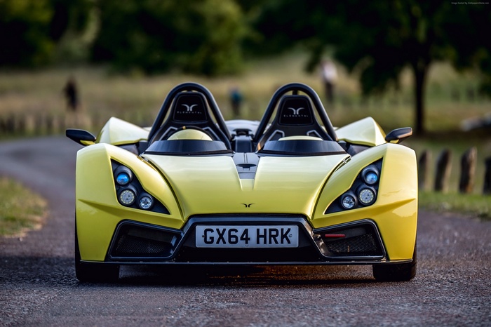 Yellow Elemental RP1 Roadster on a Track