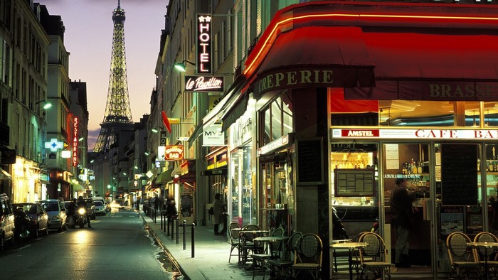 Street scene in Paris with Eiffel Tower and cafes