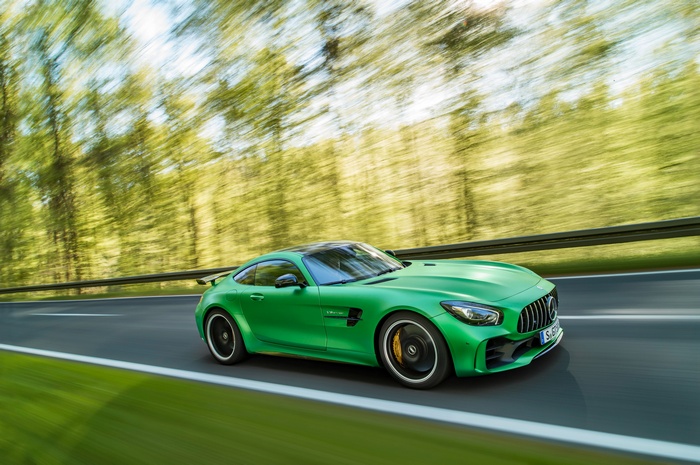 Green Mercedes-AMG GT R driving on a road