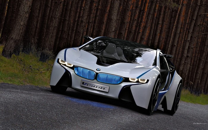 BMW Vision concept car driving on a forest road