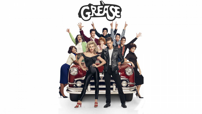 Grease Live cast with a red car