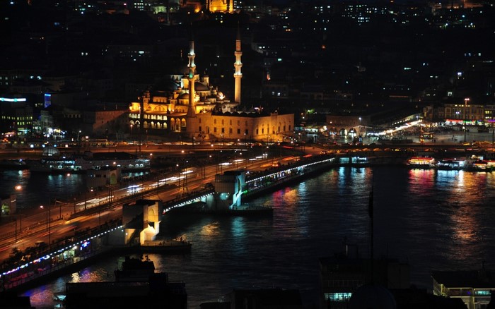 Night cityscape with Galata Bridge and mosque in Istanbul