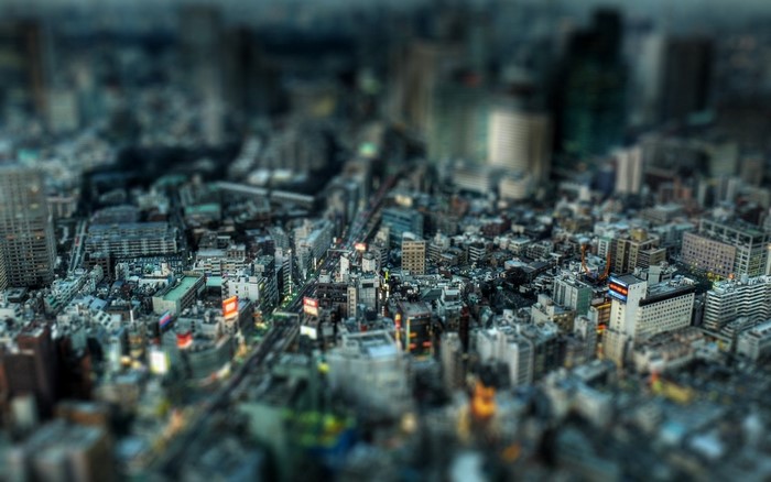 Tilt-shift aerial photography of a dense Japanese cityscape
