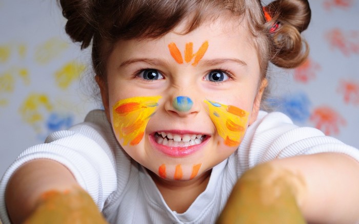 Child with face paint smiling