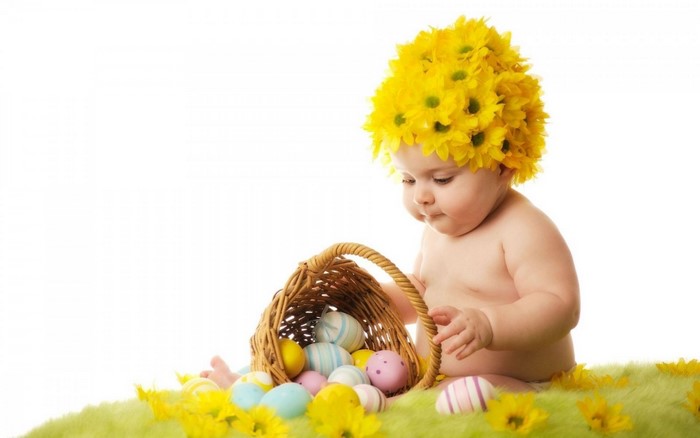 Baby with flower hat and Easter eggs