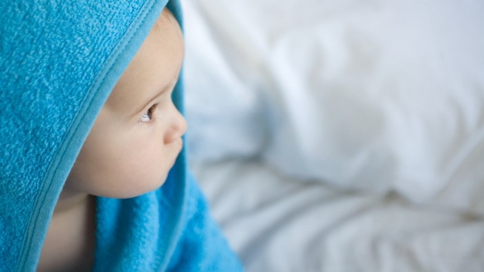 Baby wrapped in a blue towel