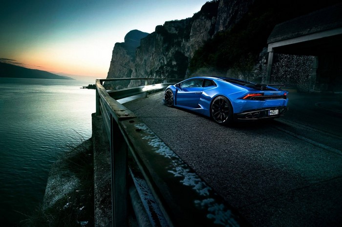Blue Lamborghini Huracan on a scenic road