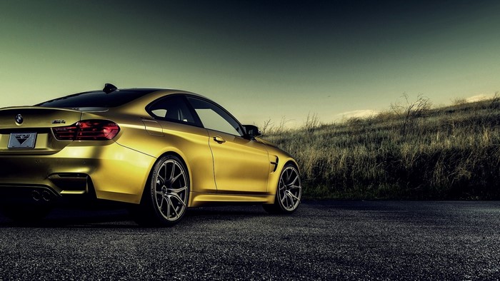 Yellow BMW M4 Coupe on Asphalt Road
