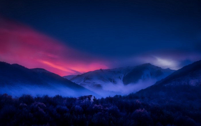 Misty mountains at dusk with colorful sky