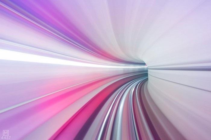 Abstract Tunnel of Purple and Pink Light Streaks