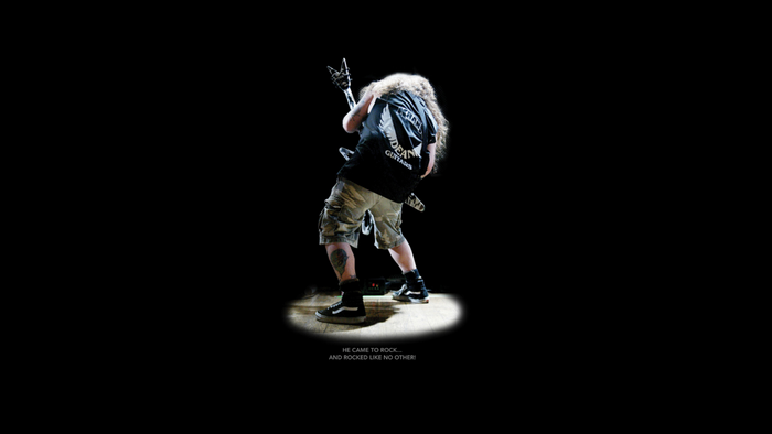 Dimebag Darrell playing guitar on stage