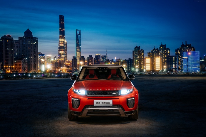 Red Range Rover Evoque in a City at Night