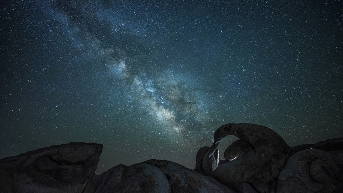 Milky Way over rock formations at night