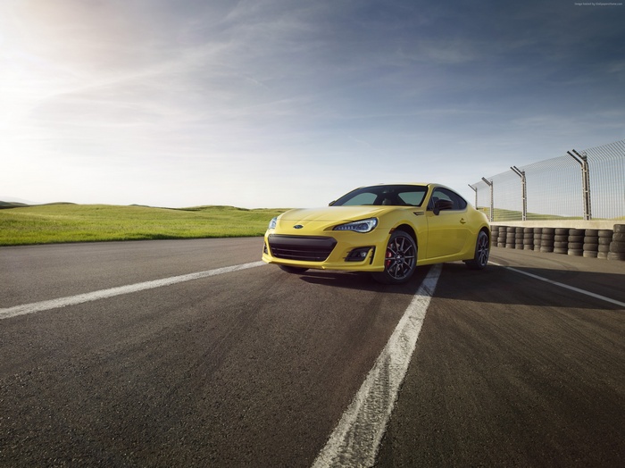 Yellow Subaru BRZ on a Racetrack