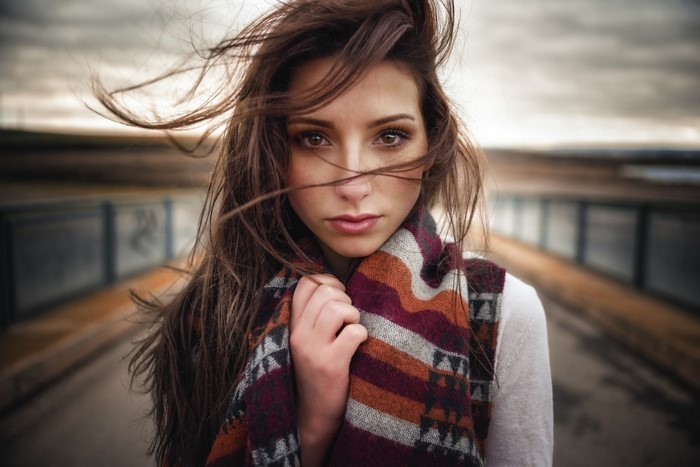 Woman with long brown hair and scarf