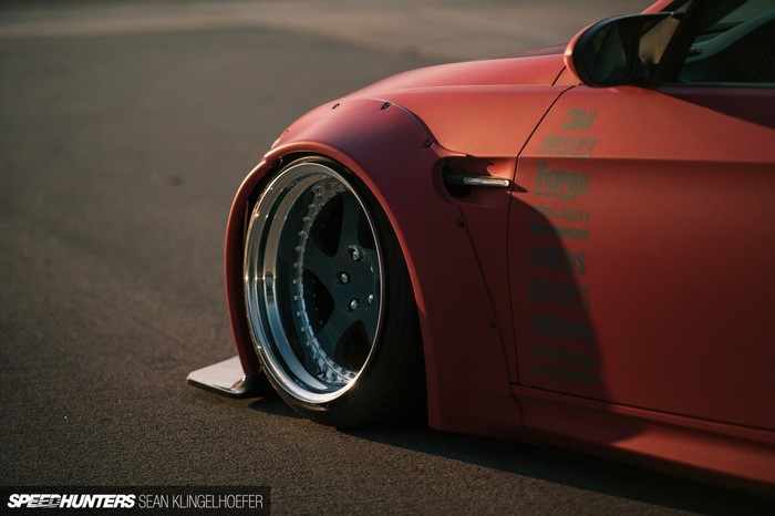 Red BMW E92 M3 with widebody kit and custom wheels