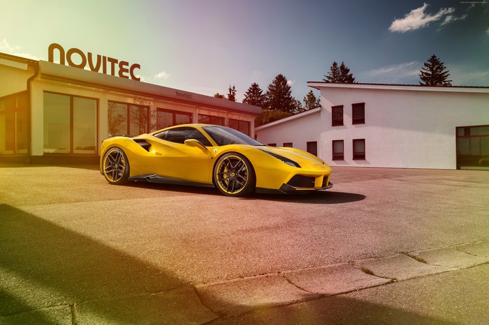 Yellow NOVITEC Ferrari 488 GTB parked outside building
