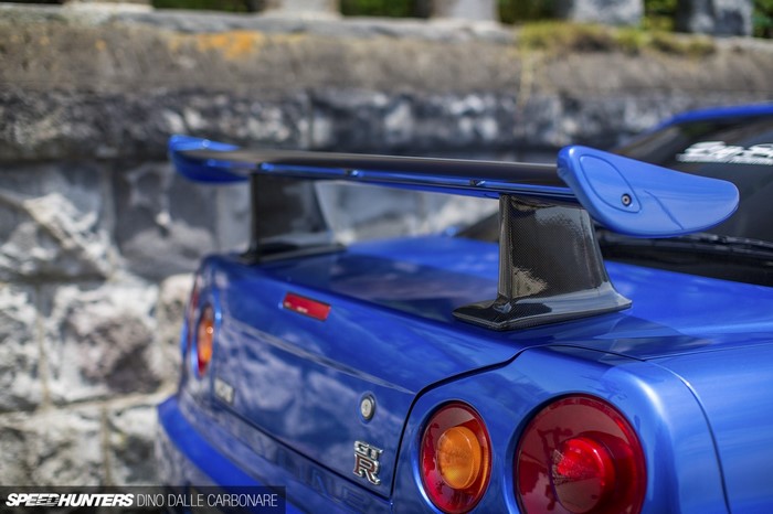 Blue Nissan Skyline R34 GT-R with Carbon Fiber Wing