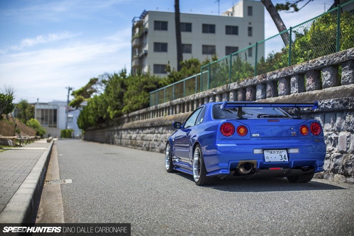 Blue Nissan Skyline R34 GT-R parked on a street