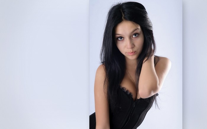 Elegant Brunette Woman in Black Dress Portrait