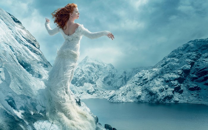 Amy Adams in a white dress on a snowy mountain