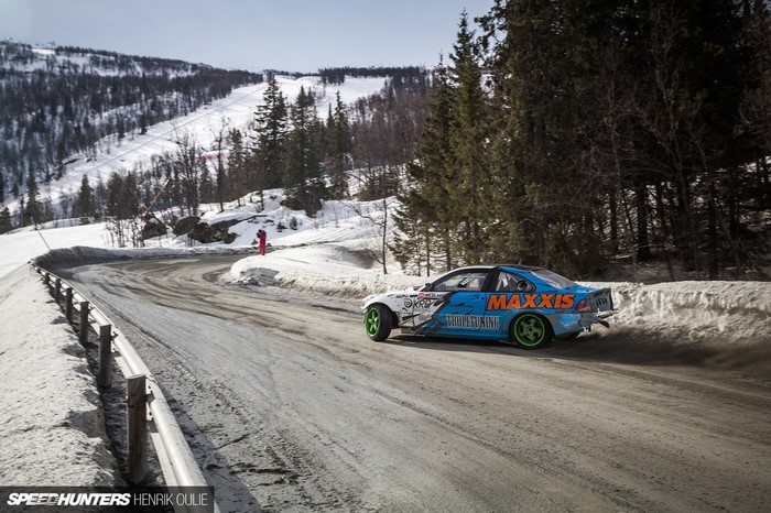 Drifting BMW M3 on a snowy mountain road