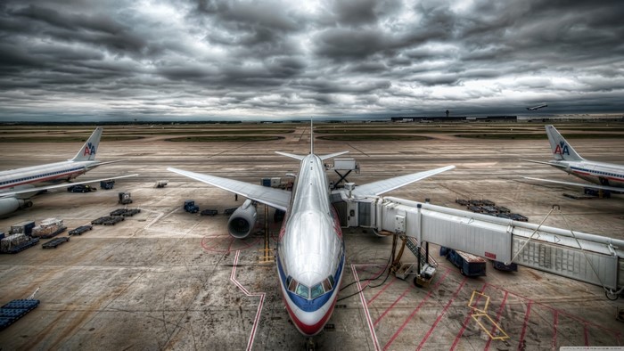 American Airlines airplanes at airport under cloudy sky