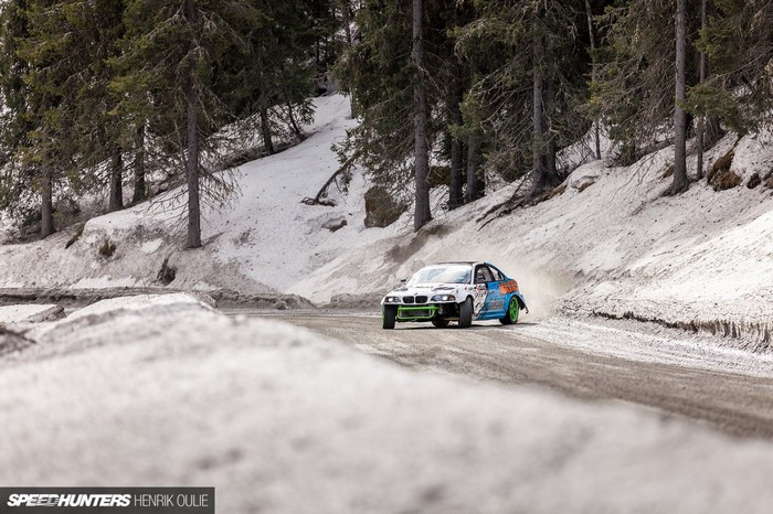 Drifting BMW M3 on a snowy mountain road