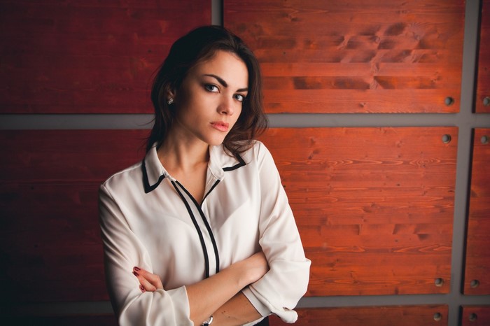 Woman in white shirt with black trim