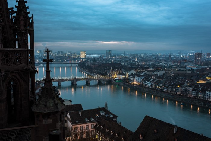 Basel cityscape with Rhine river and bridges at dusk