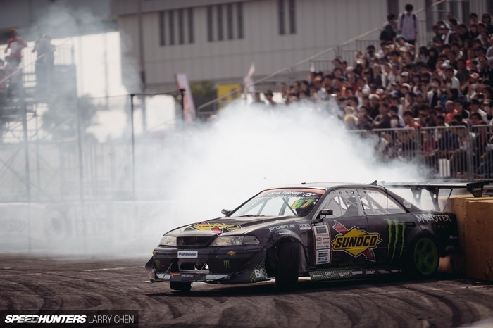 Drifting sports car with Sunoco and Monster Energy livery