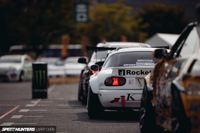 Drifting cars lined up on a race track