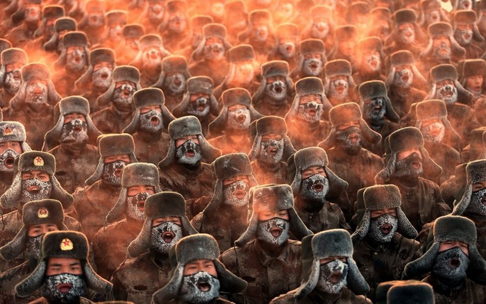 Chinese soldiers in fur hats with frost on faces