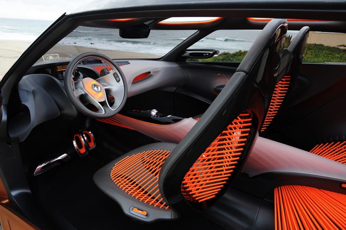 Interior of a Renault Captur crossover with orange accents