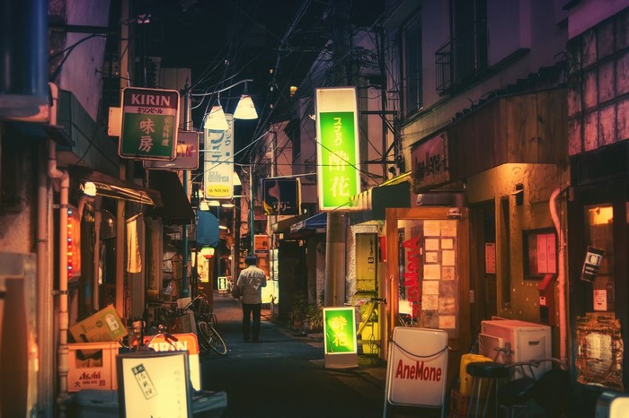 Night alley in Japan with Kirin and Suntory signs
