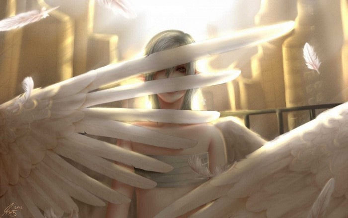 Angel with white wings in golden light