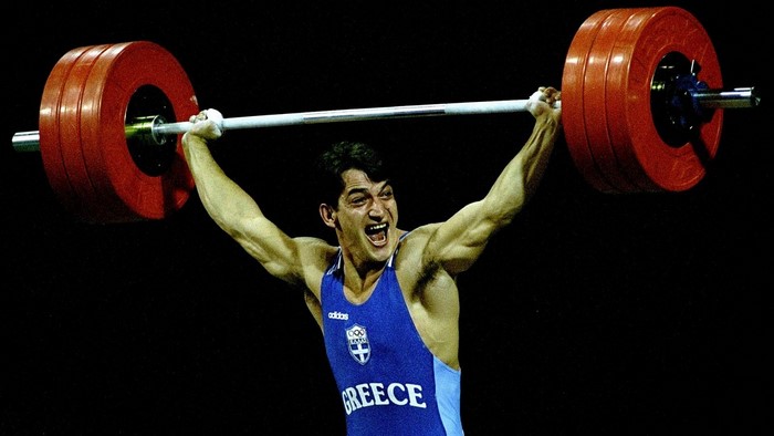 Pyrros Dimas weightlifting a barbell