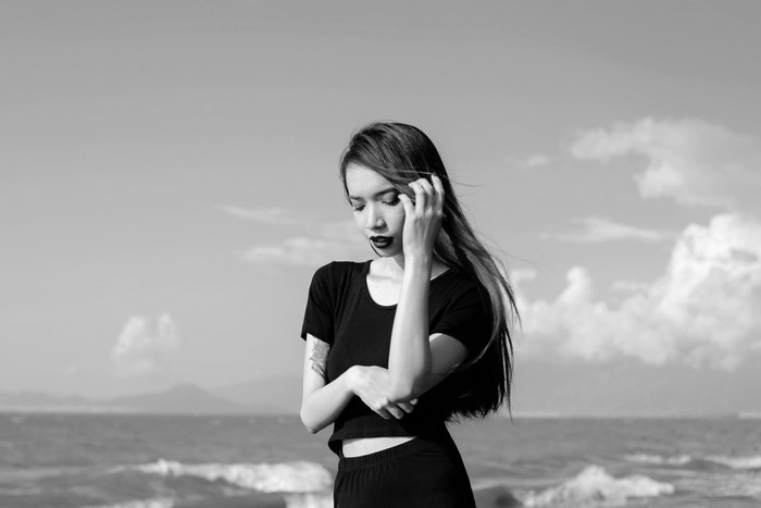 Monochrome portrait of a woman on a beach