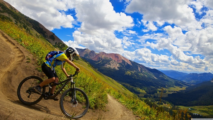 Man mountain biking on a mountain trail 4K