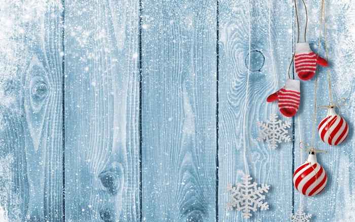 Christmas decorations on a blue wooden background with snow