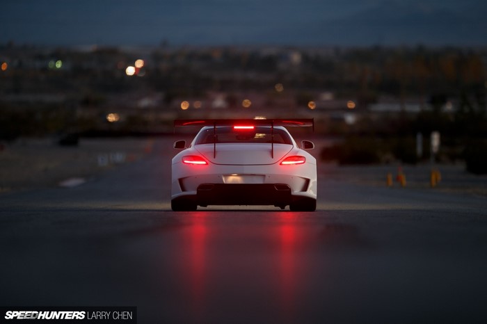White Mercedes-Benz SLS AMG with Spoiler at Dusk