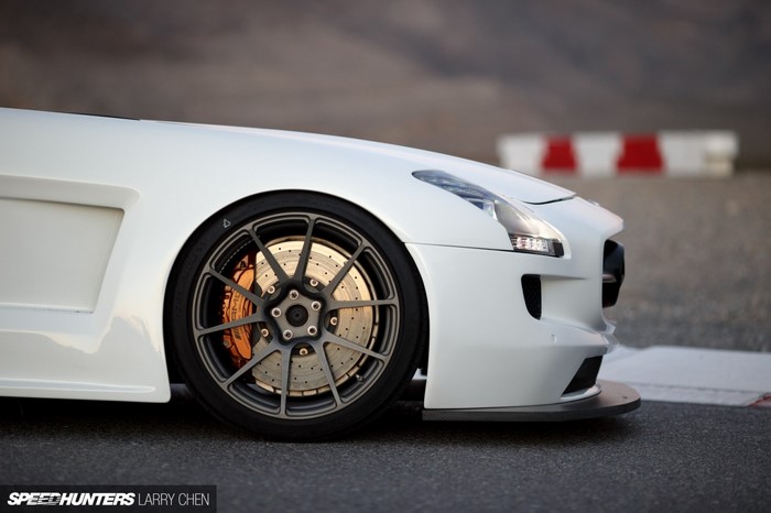 White Mercedes-Benz SLS AMG with racing wheel and brake