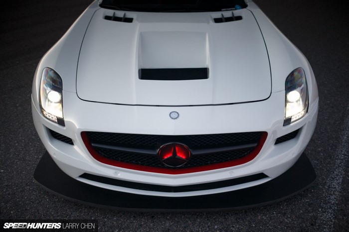 White Mercedes-Benz SLS AMG with red grille accent