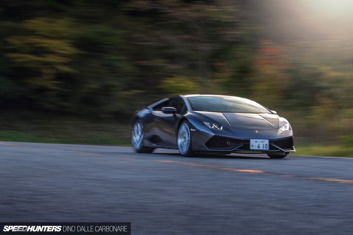 Lamborghini Huracan driving on a road