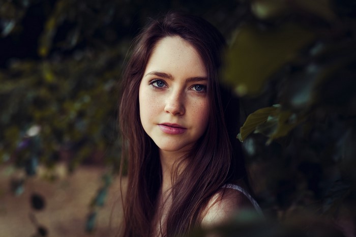 Young woman with brown hair and blue eyes, portrait