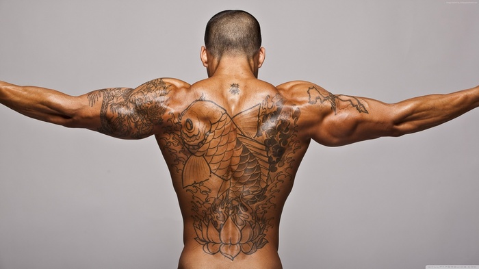 Man with Koi fish tattoo on back